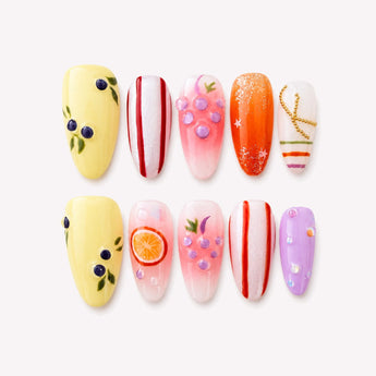 Summer Fruit Medley press-on nails with berry-like clusters, citrus accents and glossy jelly details.