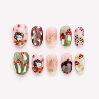 Hedgehog’s Secret Garden cute short fall nails with hedgehog art, raised red mushrooms and leafy details.