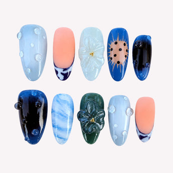 Lagoon Bloom blue jelly nails with clear water-drop domes, translucent flowers and marbled aqua details.