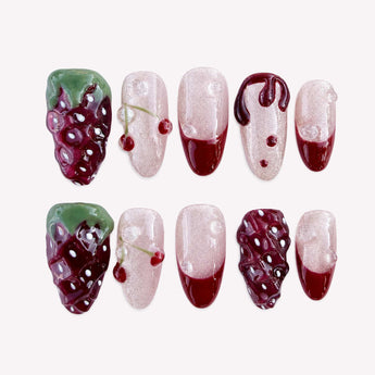 Crimson Orchard cute strawberry nails with raised red fruit, paired cherries and pearly short almond details.