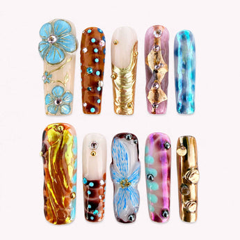 Azure Gilded Garden chrome flower nails with blue 3D blooms and gold accents