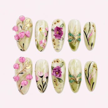 Celadon Rose Reverie green flower nails with raised pink roses, dragonfly motifs, and gold-tone accents
