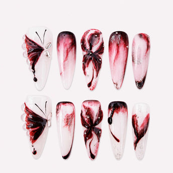 Velvetwing Nocturne burgundy 3D butterfly press on nails with smoky ombre details in a long stiletto presentation