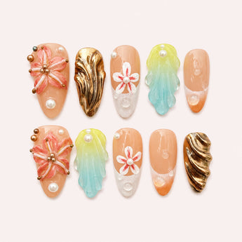 Lagoon Bloom Mosaic tropical flower press on nails with coral raised blooms, aqua-green relief, and bronze-gold accents
