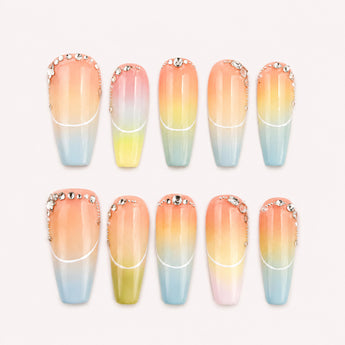 Prism Arc Reverie pastel French tip press on nails with soft multicolor ombre panels and clear rhinestone-like accents