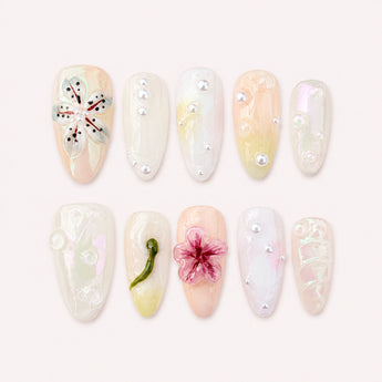 Dewlit Blossom Veil pink flower nails with raised magenta and translucent-white blooms, pearl-like beads, and clear milky bases