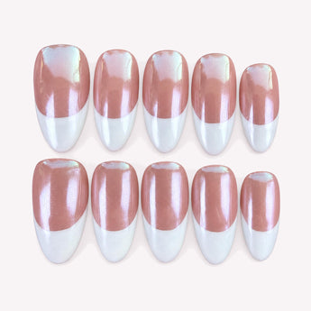 Softly Yours short almond French tip nails with a rosy nude base, translucent tips, and a soft chrome-like sheen.