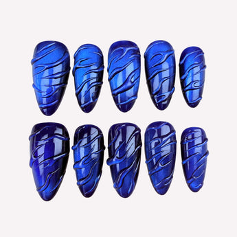 Cobalt Current press on nails with blue cat-eye shimmer, jelly-like depth and raised wave-like curves.