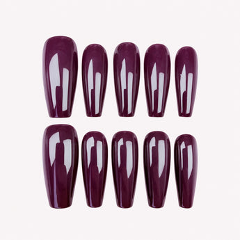 After Hours burgundy press on nails with a glossy finish, shown in a long coffin shape.