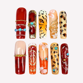 Desert Rebel press on nails with animal patterns, raised petals and turquoise-blue accents.