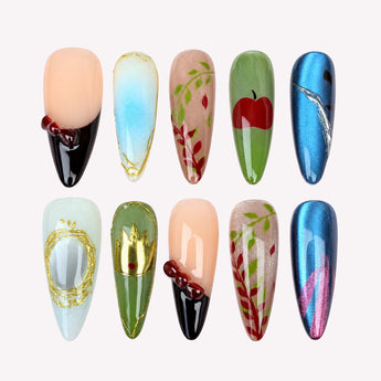 Orchard Spell press on nails with blue cat eye glow, a red apple and gold-tone crown.