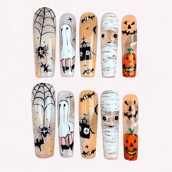 Midnight Mischief Halloween cat eye nails with ghosts, mummies, pumpkins, and spiderwebs.