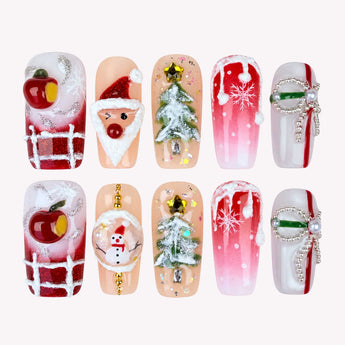 Santa’s Keepsake press on nails with 3D Santa details, snowy trees, red apples and white snowflakes.