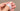 A hand with short, unpolished natural nails, shown from above to display the shape of each nail.