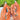 Capri Escape 3D blue French tip nails with flowers worn on a hand in a medium almond shape, featuring sculptural citrus details and a glossy finish.