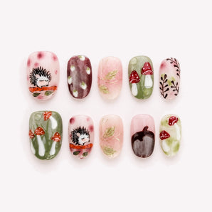 Hedgehog’s Secret Garden cute short fall nails with hedgehog art, raised red mushrooms and leafy details.