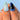 Model-hand view of Lagoon Bloom short almond blue jelly nails with peach accents and raised water-drop details.