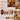 Amber chrome nail design inspiration with translucent brown marbling, gold details, 3D floral accents, and sculptural textures