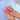 Rosy Afterglow press-on nails featuring a soft pink fade, berry-red color and glossy fine sparkle.