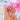 Short almond Rosy Haze press-on nails with rich red color blooms, pale pink gradients and a light-catching glossy finish.