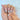 First Blush glossy French press-on nails with warm nude cat-eye shimmer, white tips, and a short almond silhouette.