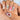 Santa’s Keepsake medium square press on nails with beaded bow-like loops and red and green accents.
