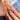 Safari Bloom press on nails with gold-tone curls over mint and shimmering pink fold-like ridges.