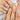 Gilded Garden press on nails with curved stems, pointed leaves and raised flower petals.